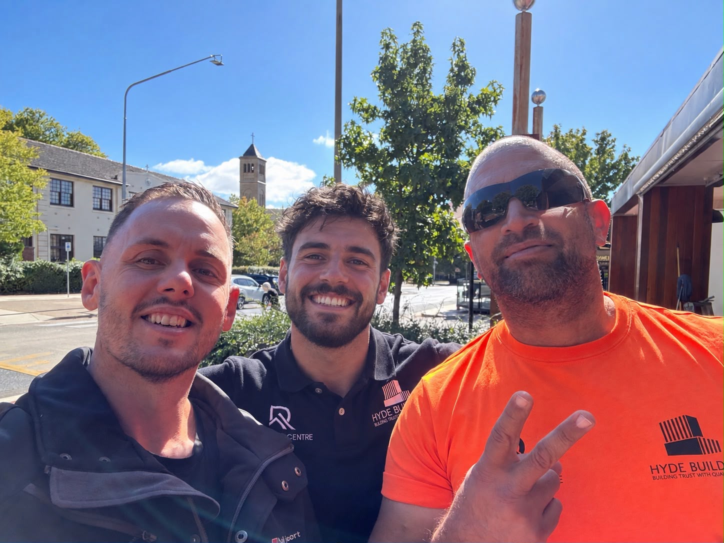 Three trade business owners outside after a coaching session
