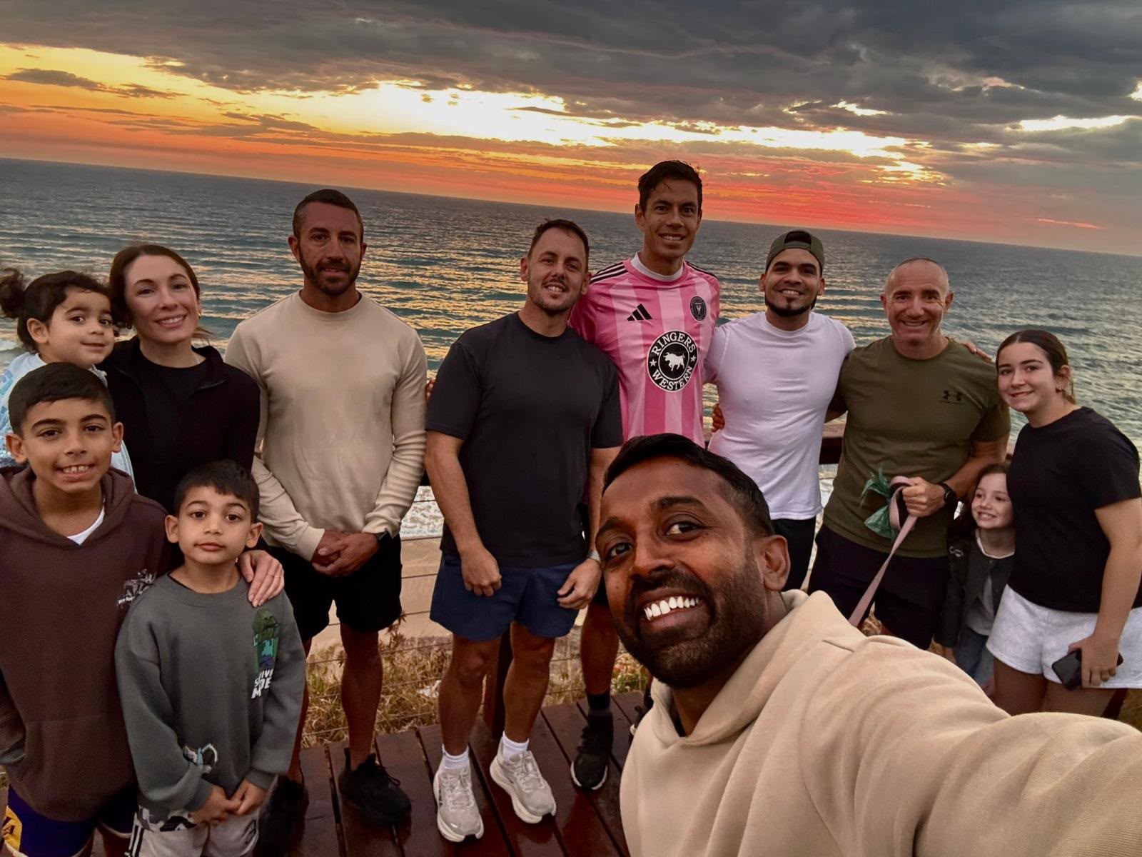 The Sunday crew and their families above the beach at sunrise